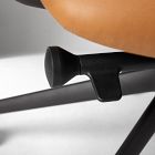 Close-up of chair gas lift cylinder and frame mechanism