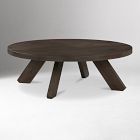 Round dark wood coffee table with angled legs