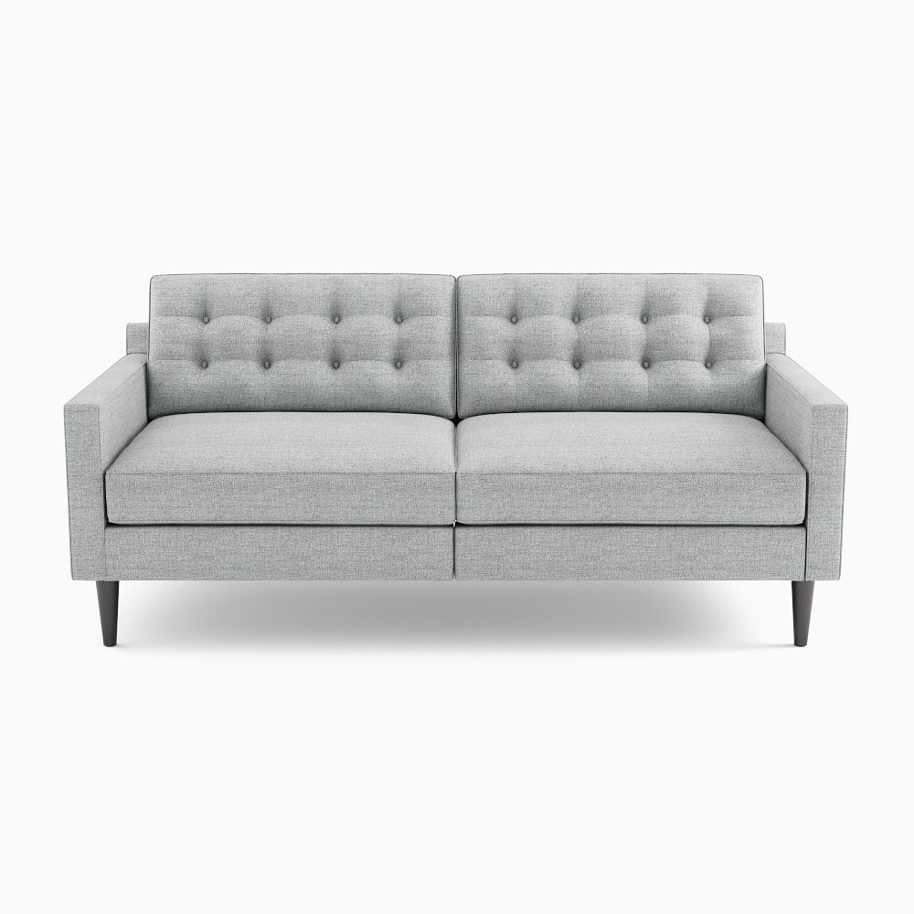 Gray tufted two-seat sofa on white background