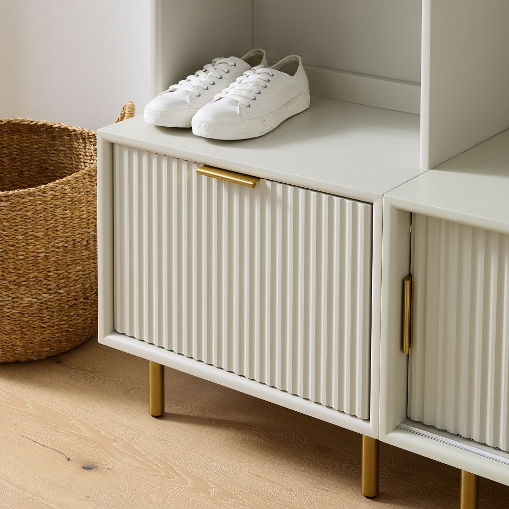 White sneakers on top of ribbed cabinet door