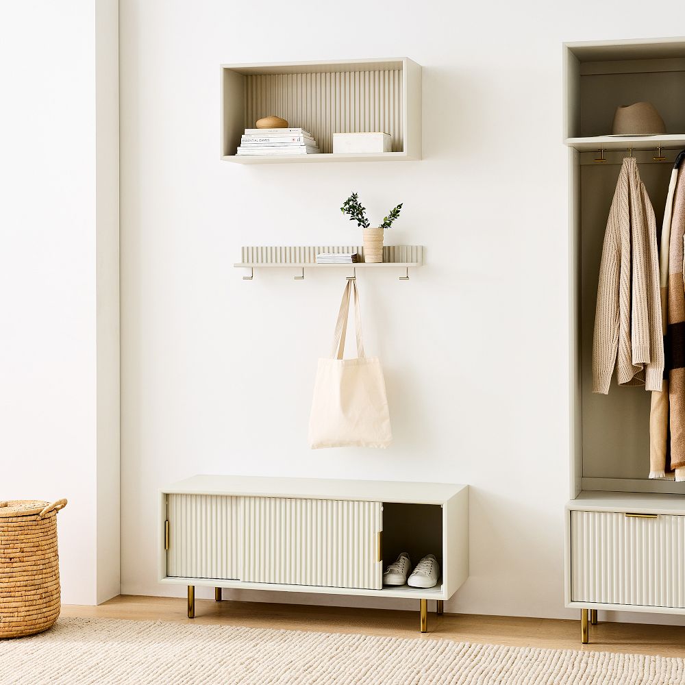 Minimalist entryway setup with small shelf and bag