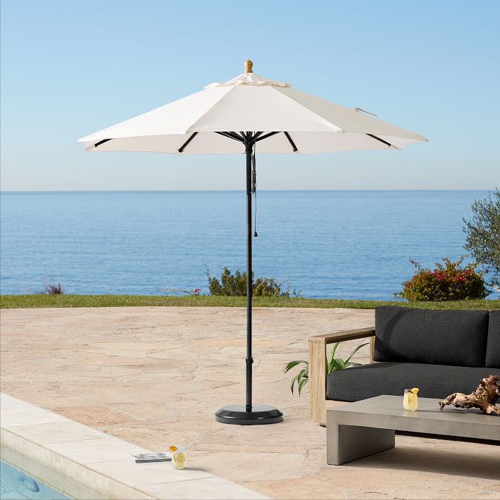 east end patio umbrella base Offset Oak Roll it where you need it Market Umbrella Base Table Umbrella
