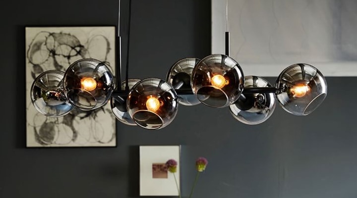 Globe glass bulbs in front of black wall