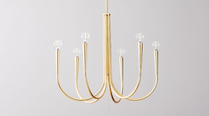 Modern gold chandelier with curved rods and circular glass bulbs