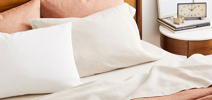 Linen sheets and pillows on a bed