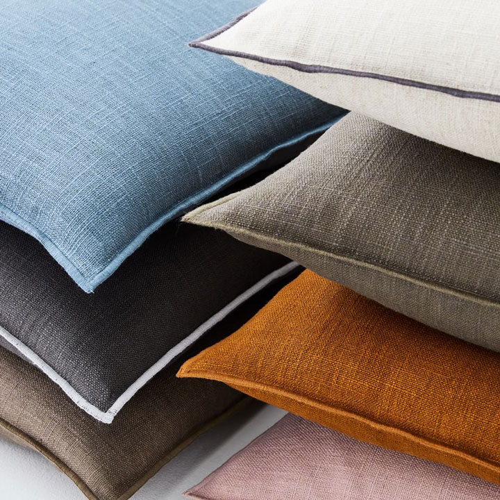 Close-up of different colored linen pillows