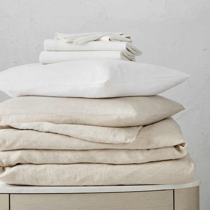 Beige linen bedding and white cotton bedding