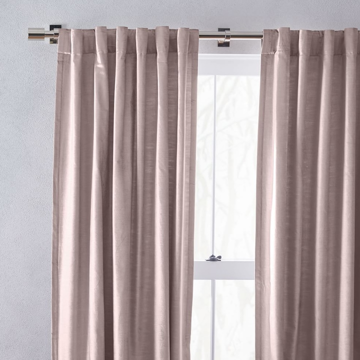 Close-up of dusty pink blackout curtains.