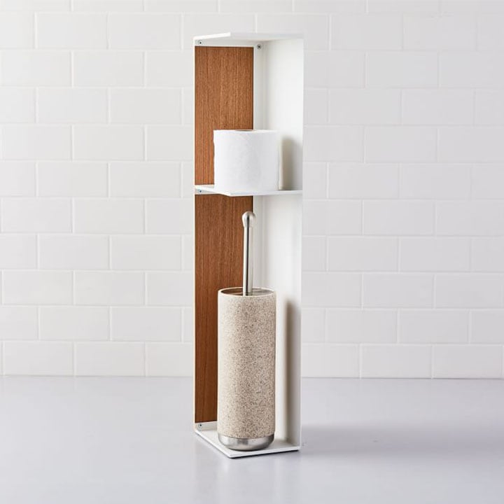 toilet paper and toilet brush on wooden stand