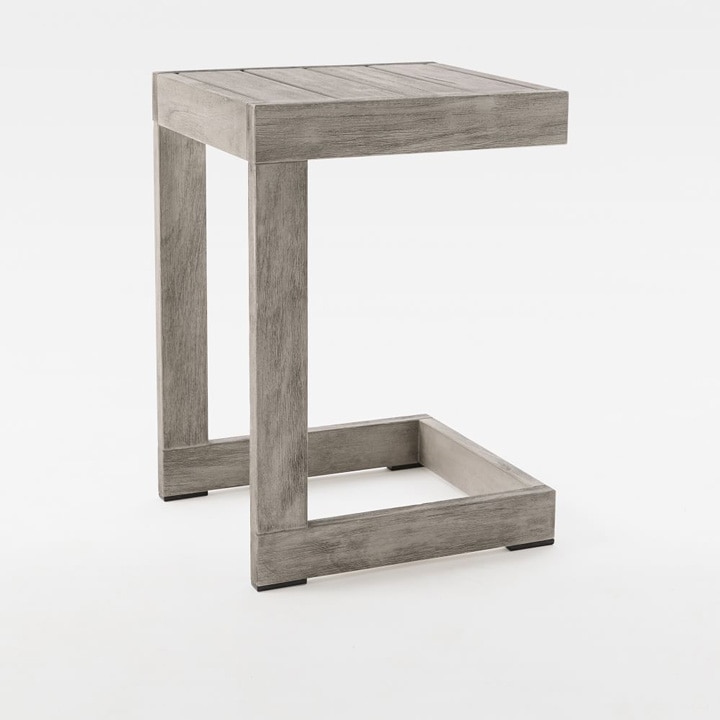 C-shaped side table in weathered gray.
