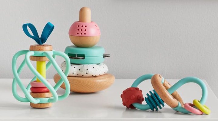 Colorful baby toys on table Colorful baby toys on table