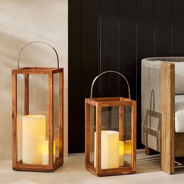 Simple, wooden lamps with candles.