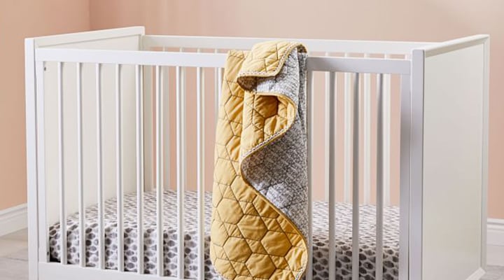 Yellow honeycomb quit hanging over crib Yellow honeycomb quit hanging over crib