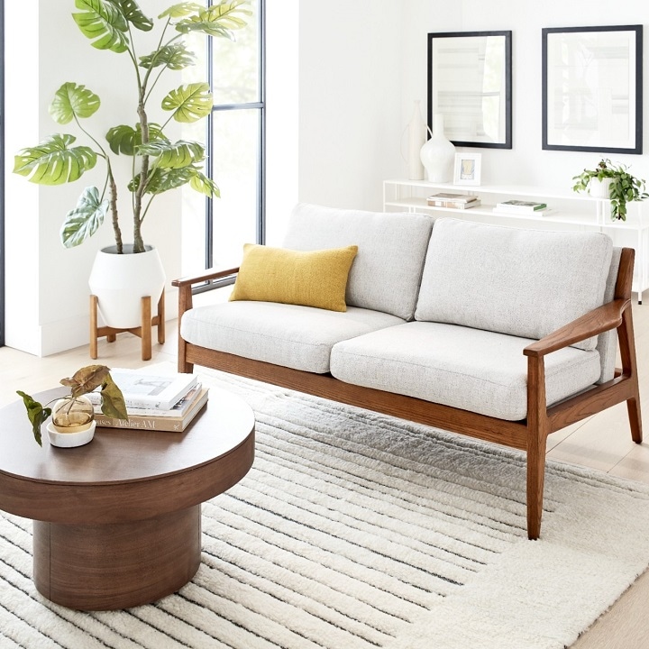 Bright mid-century modern living room with wooden accent pieces 