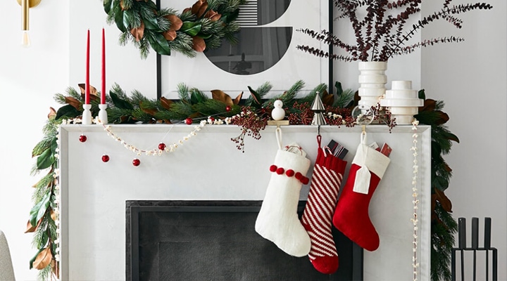 three red and white ornaments on modern fireplace with mantel decor