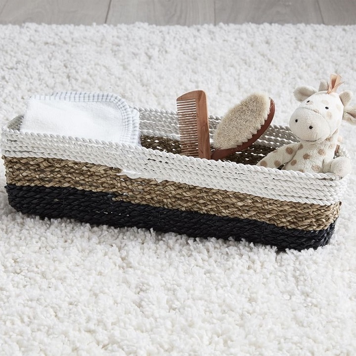 kids storage basket with bath accessories and a toy