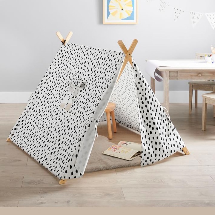 patterned kids tent in living room