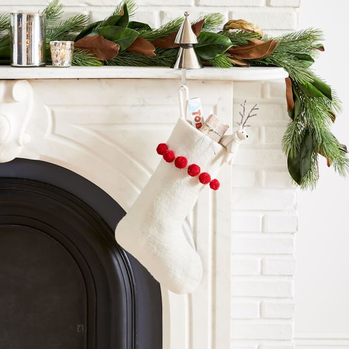 white stocking hanging on mantle
