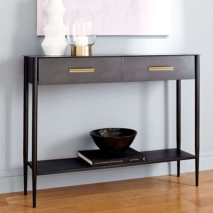 Minimal console table with decor and drawers for hidden storage