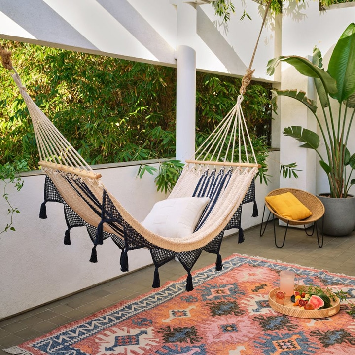Fringed hammock and outdoor rug.