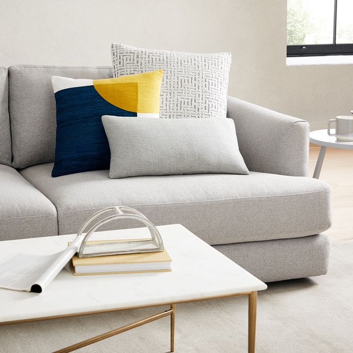 Simple gray sofa with colorful modern accent pillows