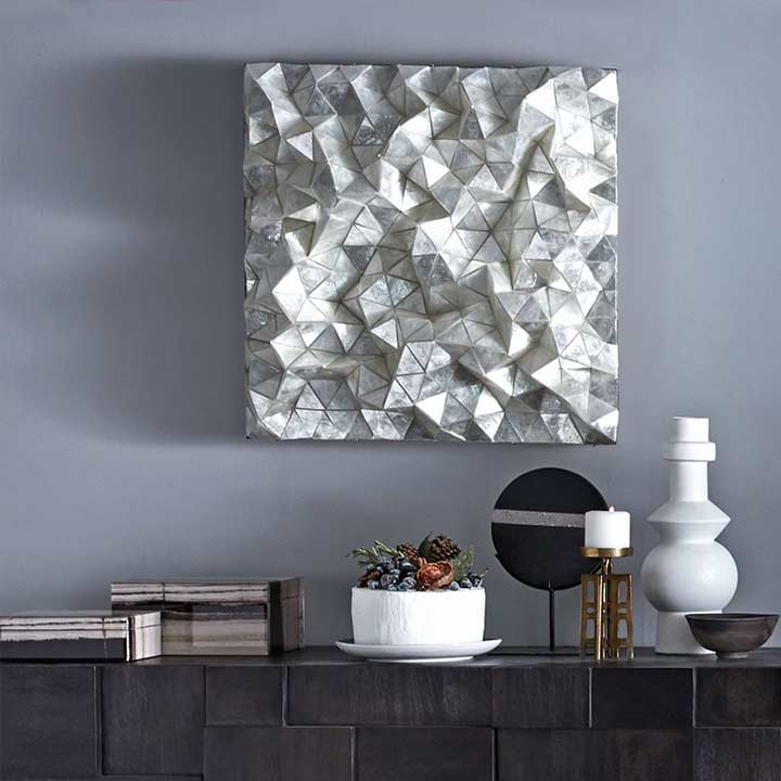 modern white dimensional art hanging on wall