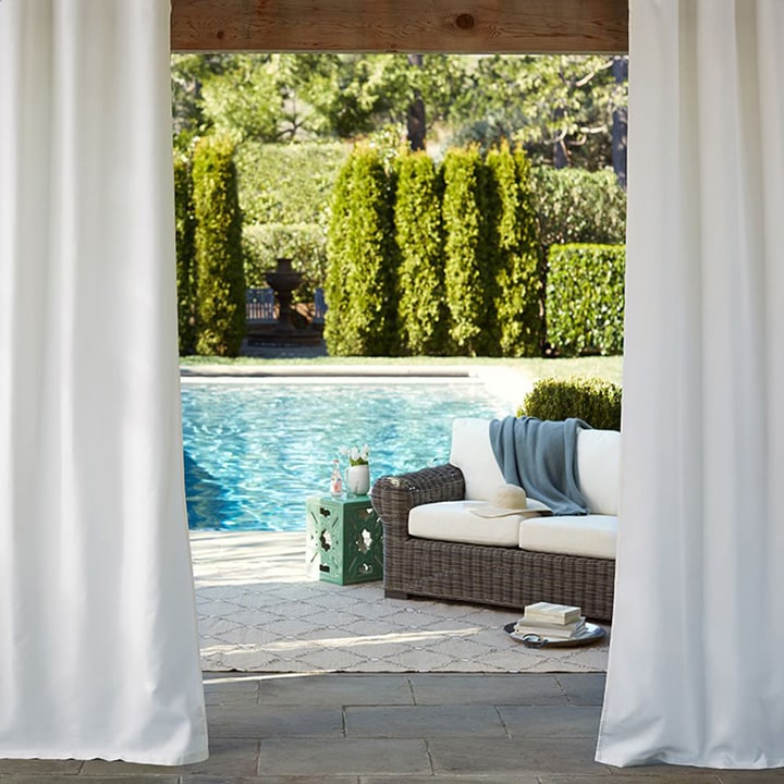 Indoor/outdoor large white curtains.