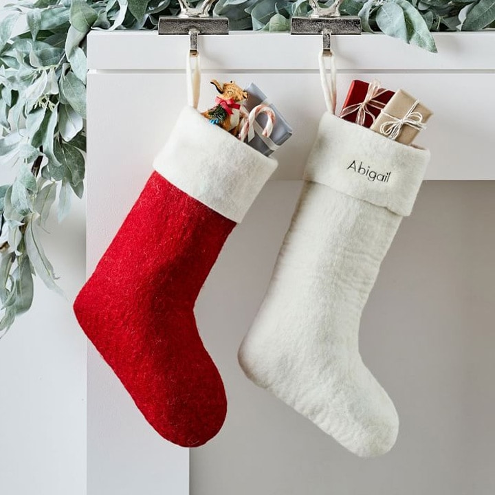 red and white stockings against white fireplace