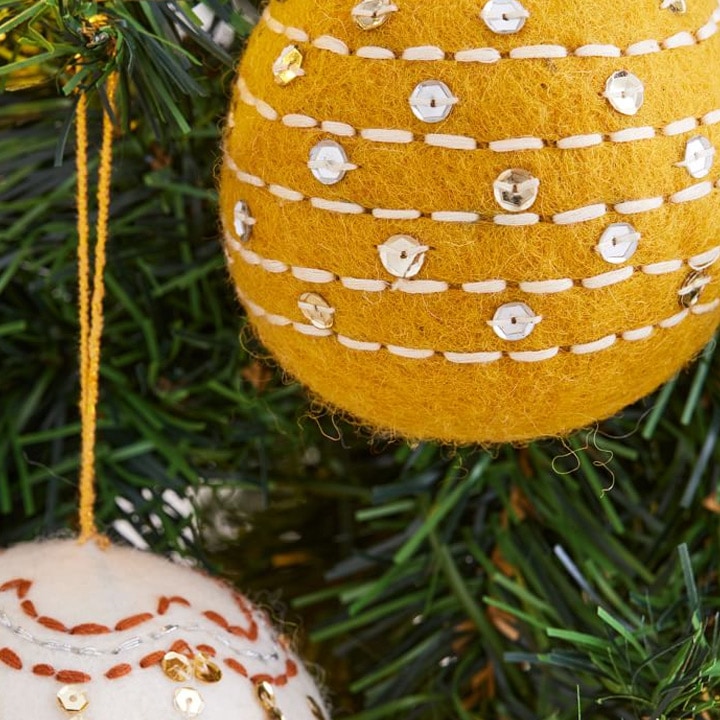 close up of yellow felt christmas ornament