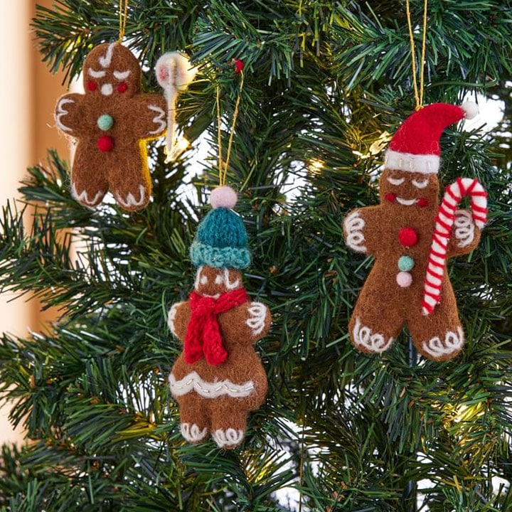 three gingerbread ornaments on tree