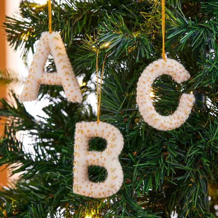 close up of letter ornaments on tree