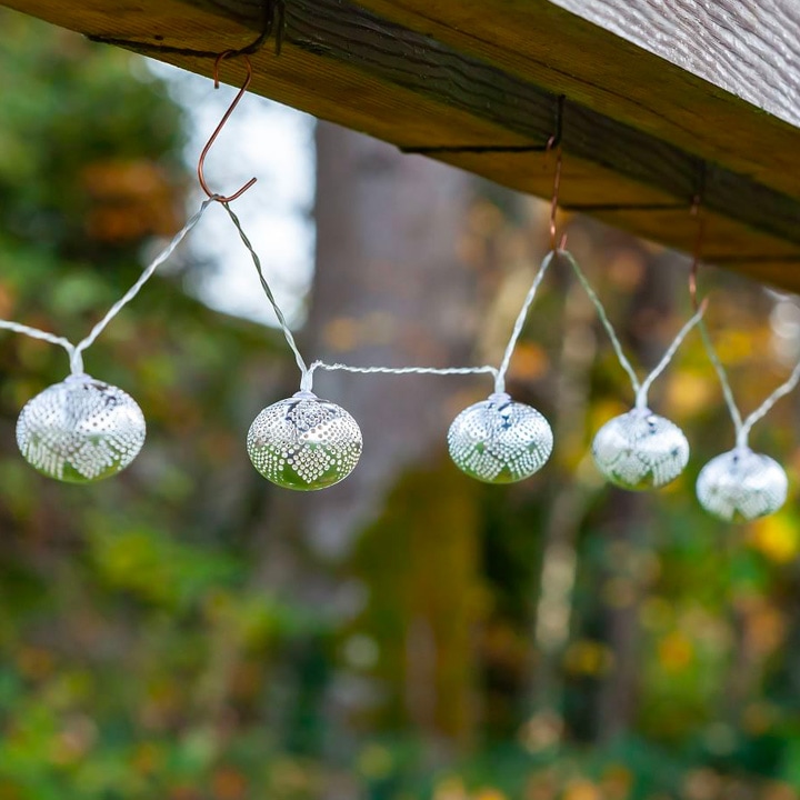 String lights hanging from wooden decking.