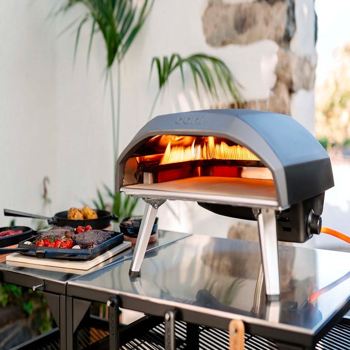 Pizza oven on stainless steel table.