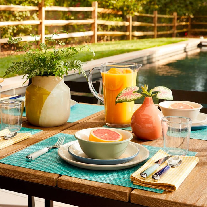 Table setting with orange juice and grapefruit.