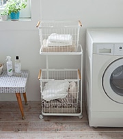 rolling basket organizer in laundry room