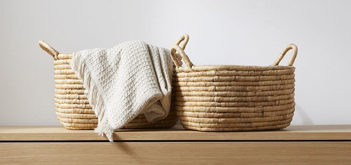 Woven seagrass baskets collection with blanket.