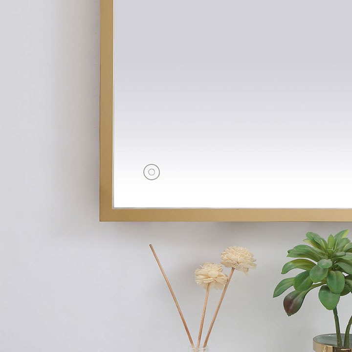 Gold framed LED mirror.