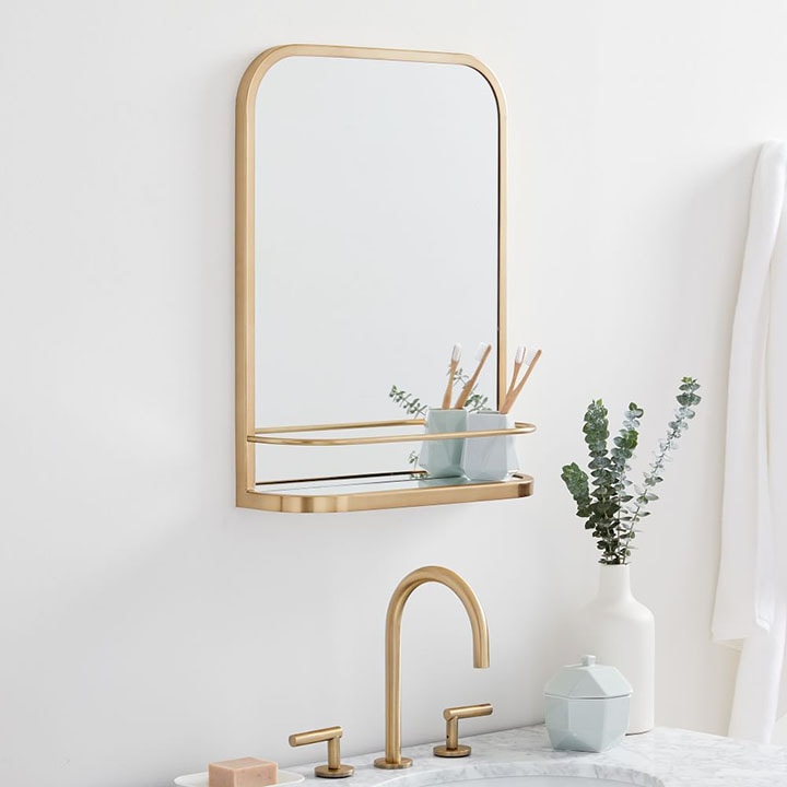 Gold seamless wall shelf mirror.