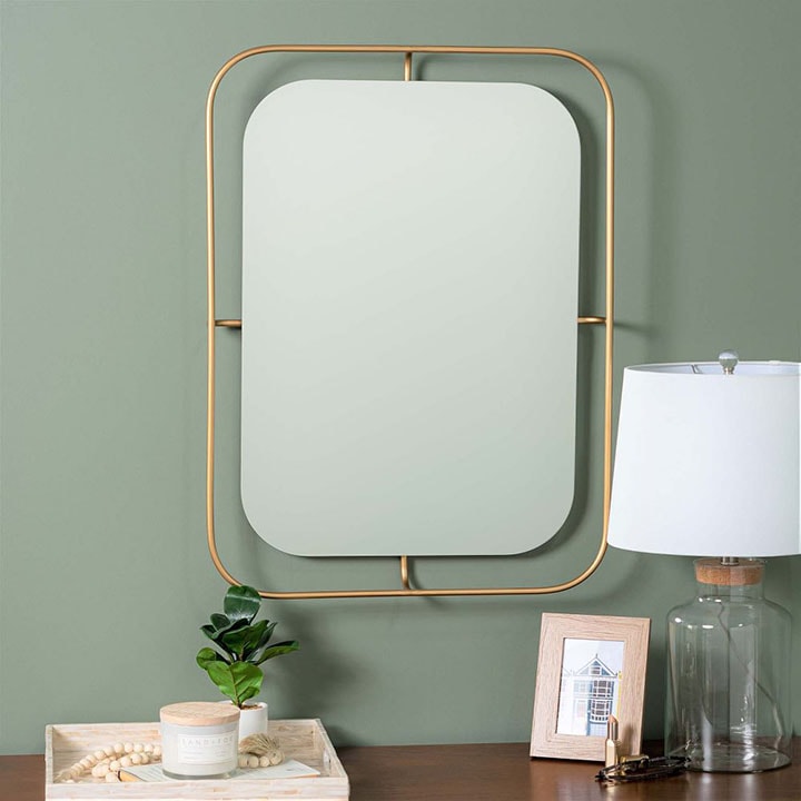 Thin gold rimmed rounded edge rectangle mirror.