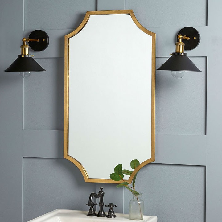 Gold framed scalloped mirror.