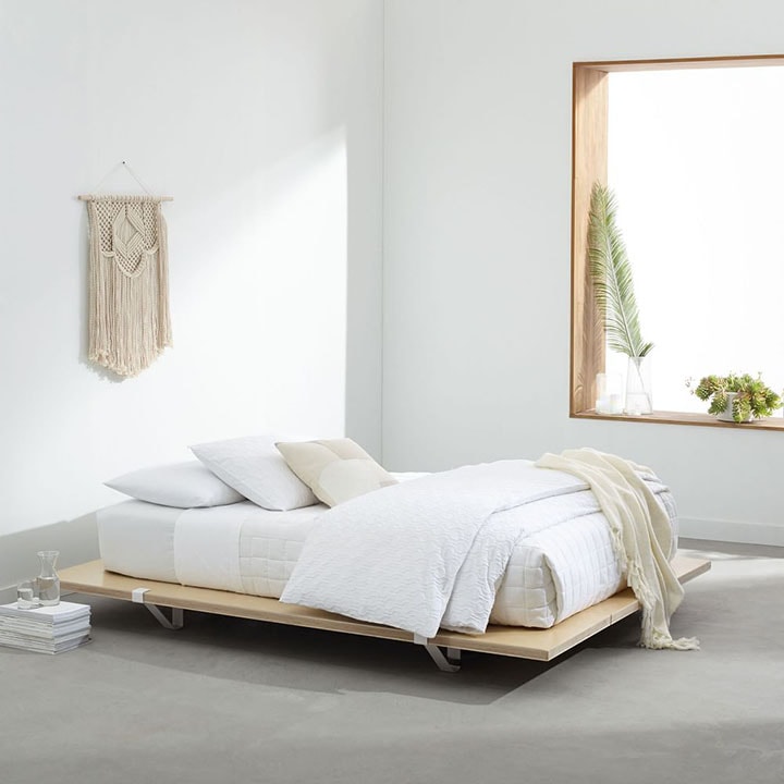 Platform bed in minimal bedroom.