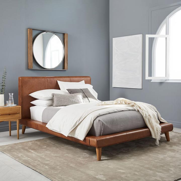 Mod Leather Platform Bed styled with neutral bedding. 