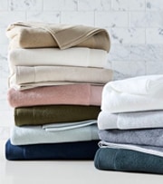 Stacks of multi colored towels.