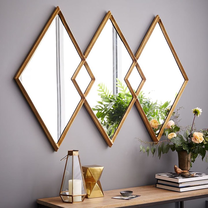 Gold overlapping-diamond mirror.