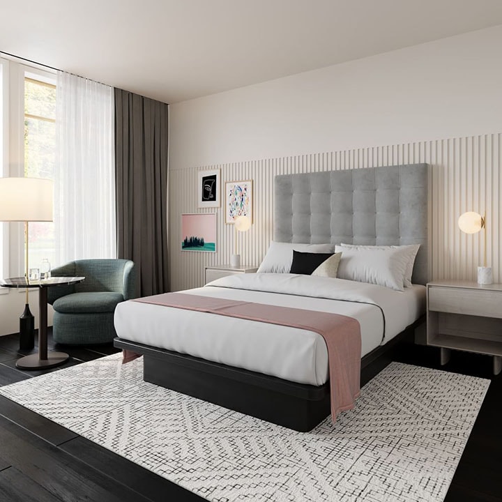 Tall, gray, velvet tufted headboard in bedroom.
