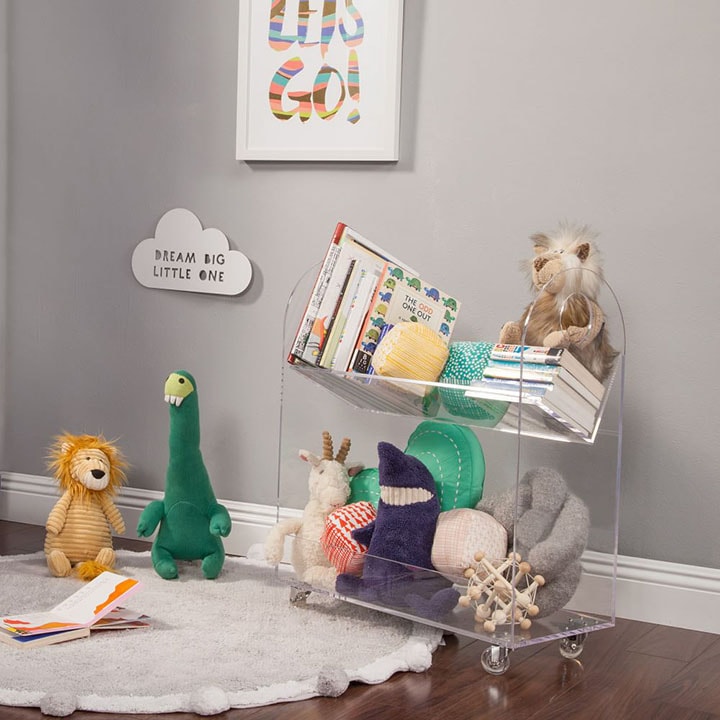 Play area with various stuffed animals and books Play area with various stuffed animals and books