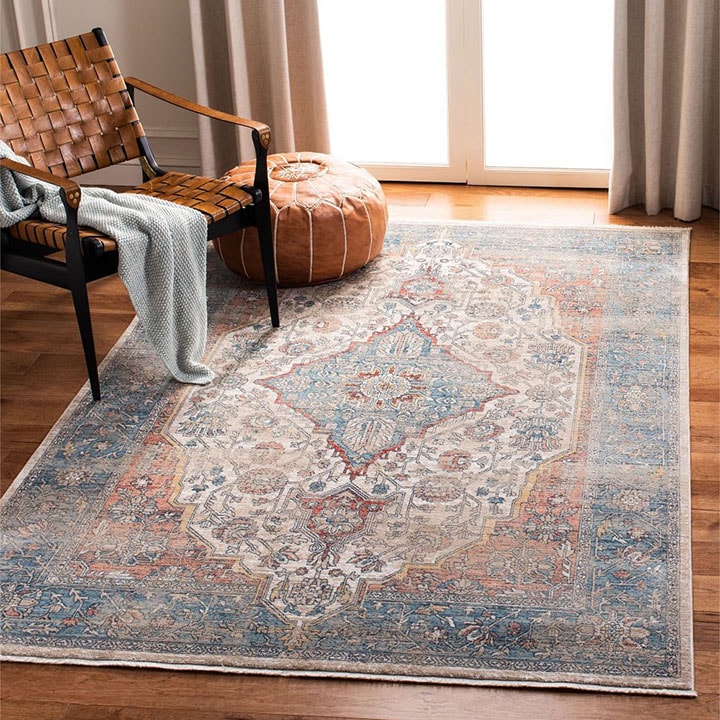 Medallion area rug acting as a meditation space with an accent chair and floor poof. Medallion area rug acting as a meditation space with an accent chair and floor poof.