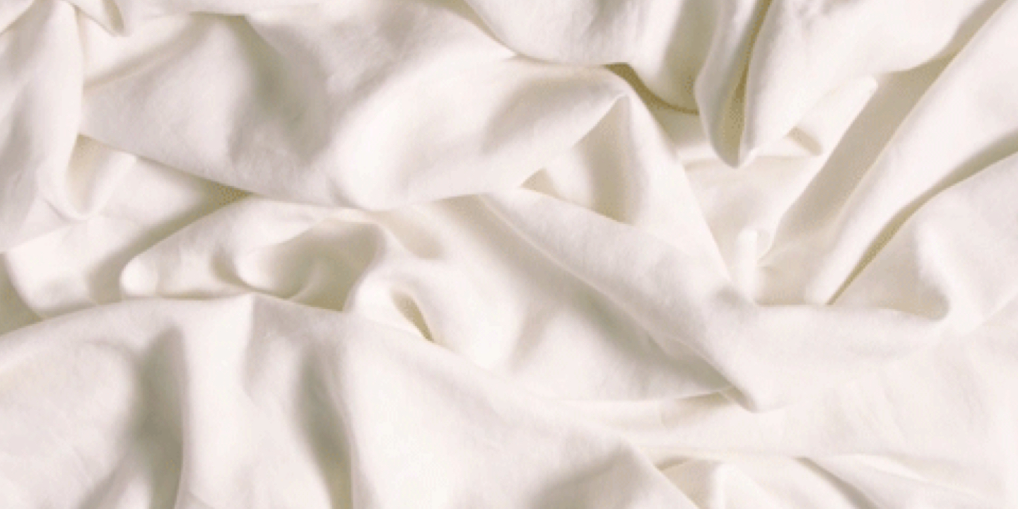off-white bed sheet