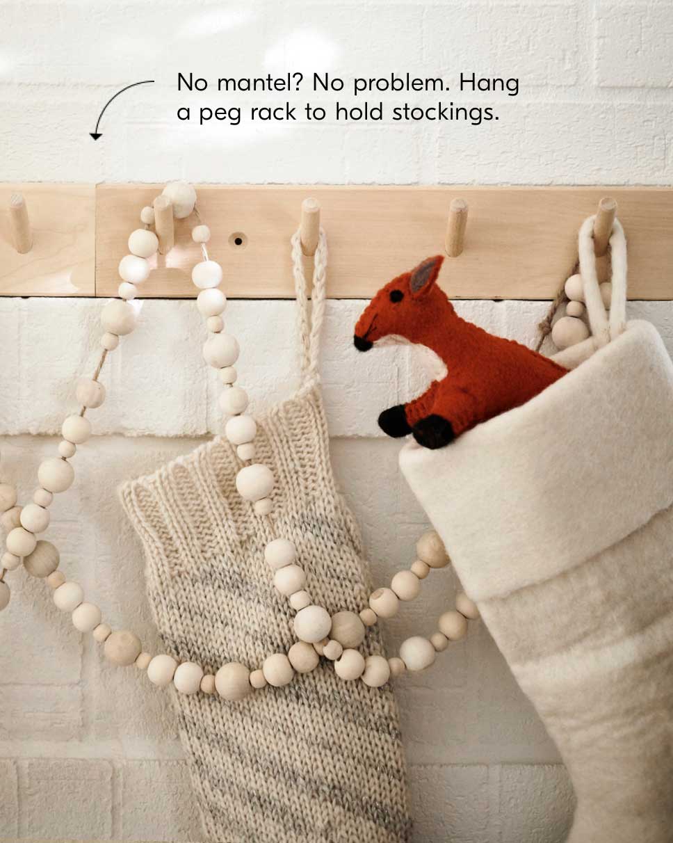 No Mantel? No problem. Hang a peg rack to hold stockings.