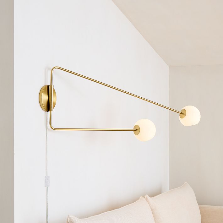 Staggered glass store sconce